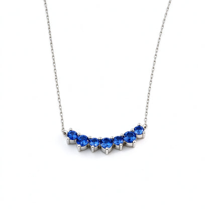DANFÉE Seven-Stone Smile sapphire necklace, angled view of the claw settings