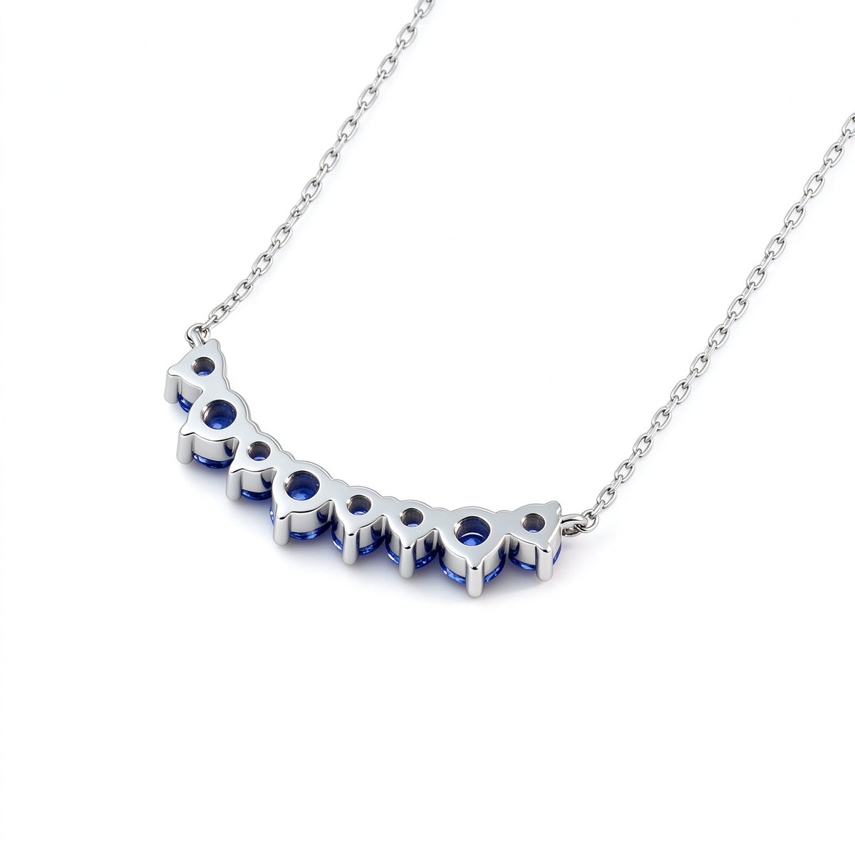 DANFÉE Seven-Stone Smile sapphire pendant, open-back gallery