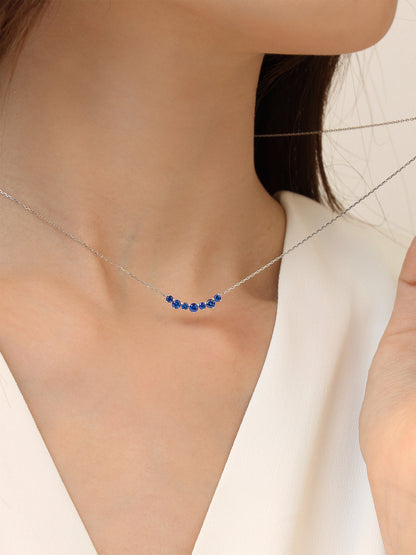 DANFÉE Seven-Stone Smile sapphire necklace worn at the collarbone