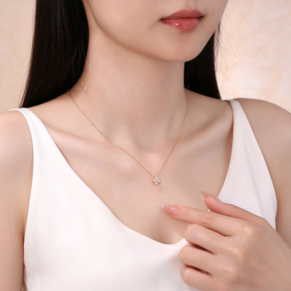 Model wearing 18K gold four-diamond flower pendant